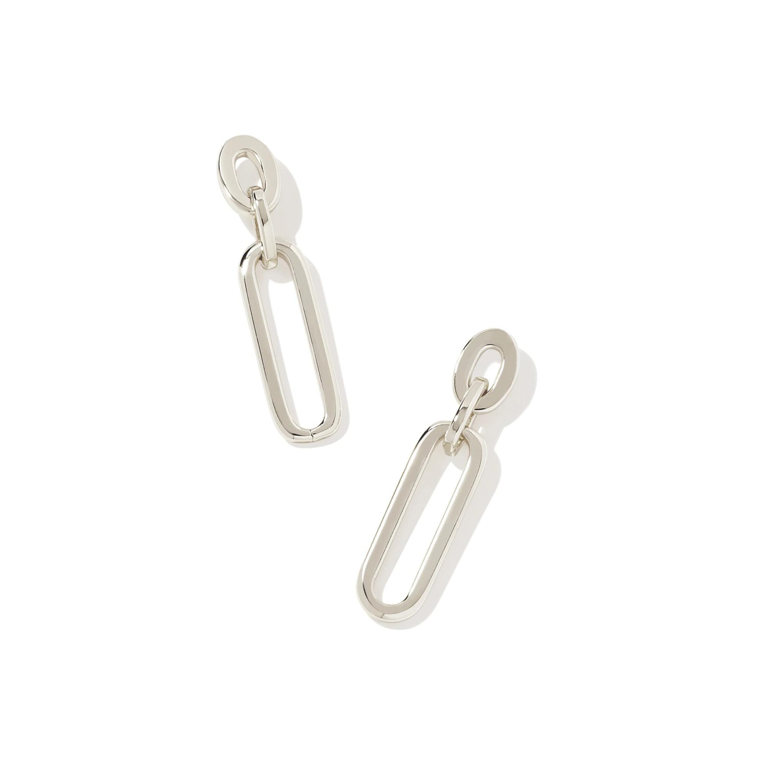 Pictured is a pair of silver chain link drop earrings on a white background. 