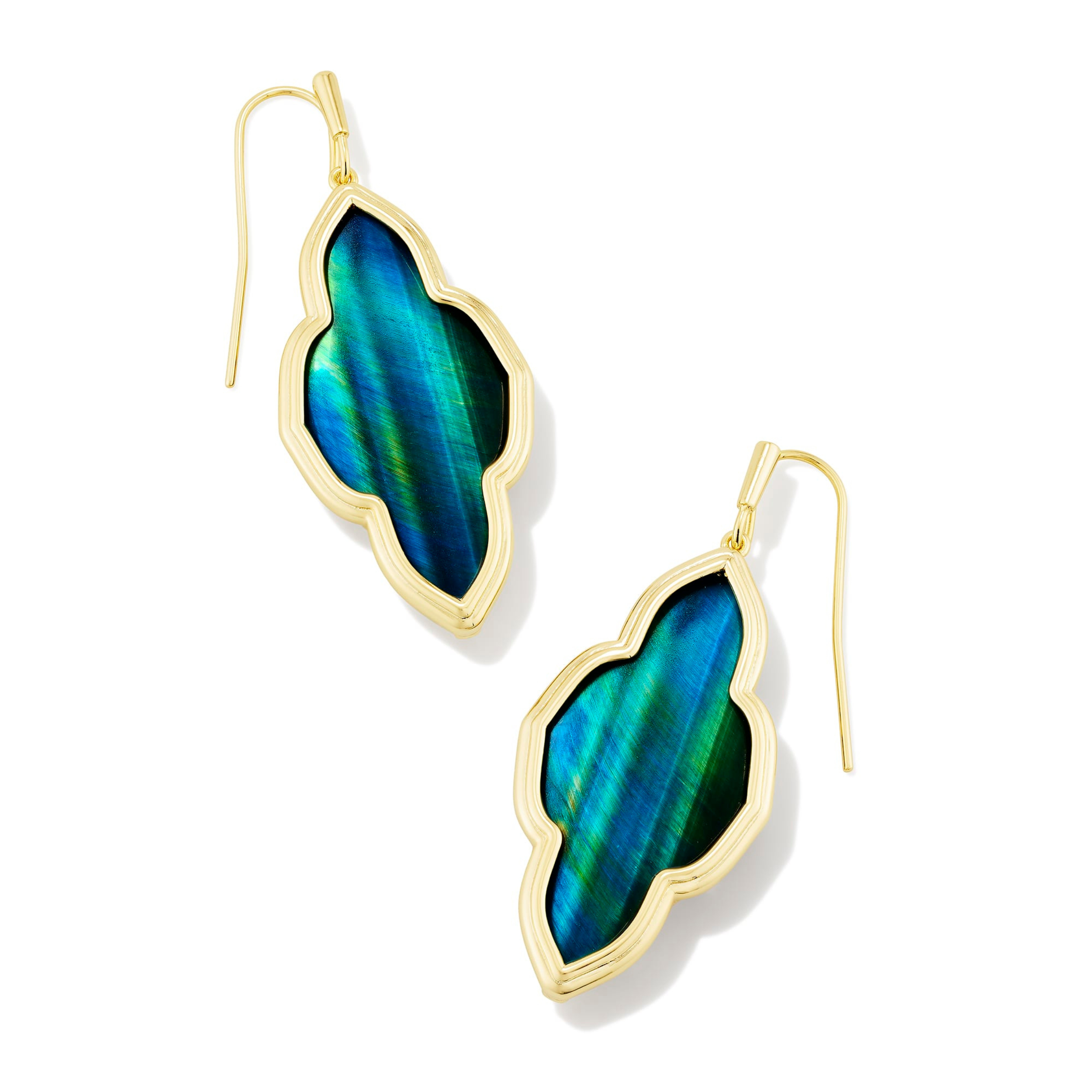 Pictured is a a pair of gold drop earrings in the abbie shape on a white background. These earrings include a gold outline with a teal tiger's eye stone.