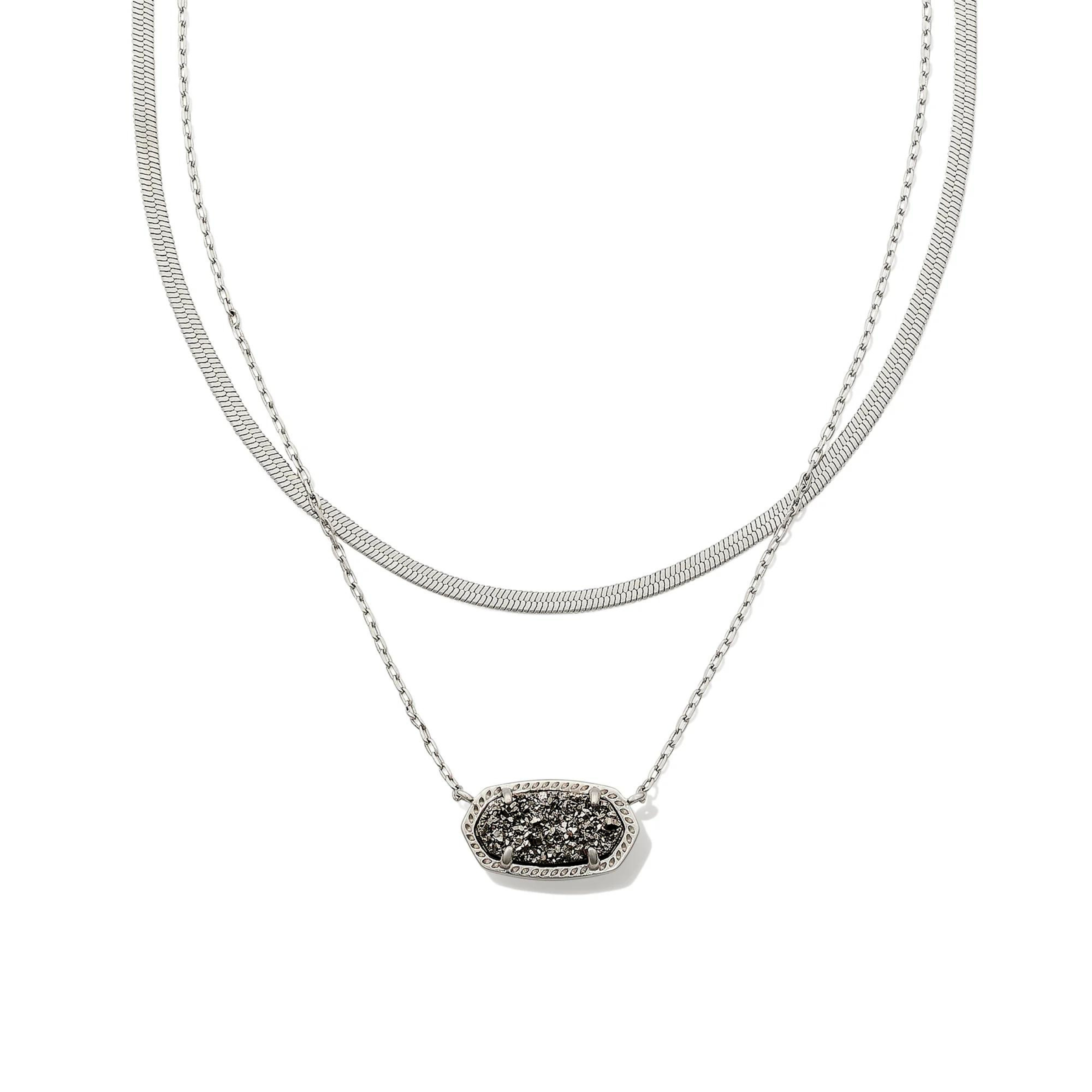 Pictured is a two strand, silver chain necklace with an oval platinum drusy pendant. This necklace is pictured on a white background.    