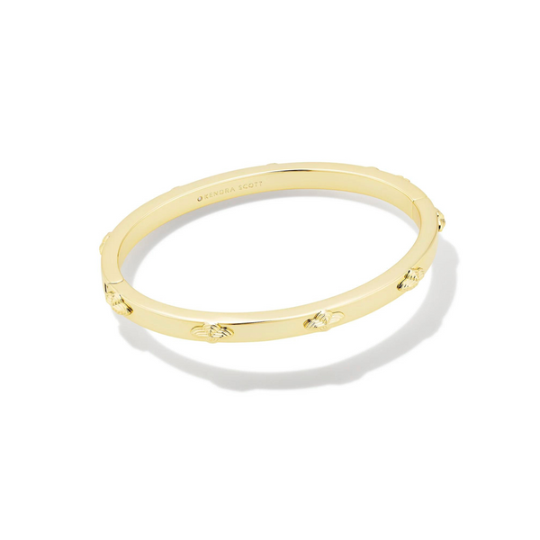 Pictured on a white background is a gold bangle bracelet. 