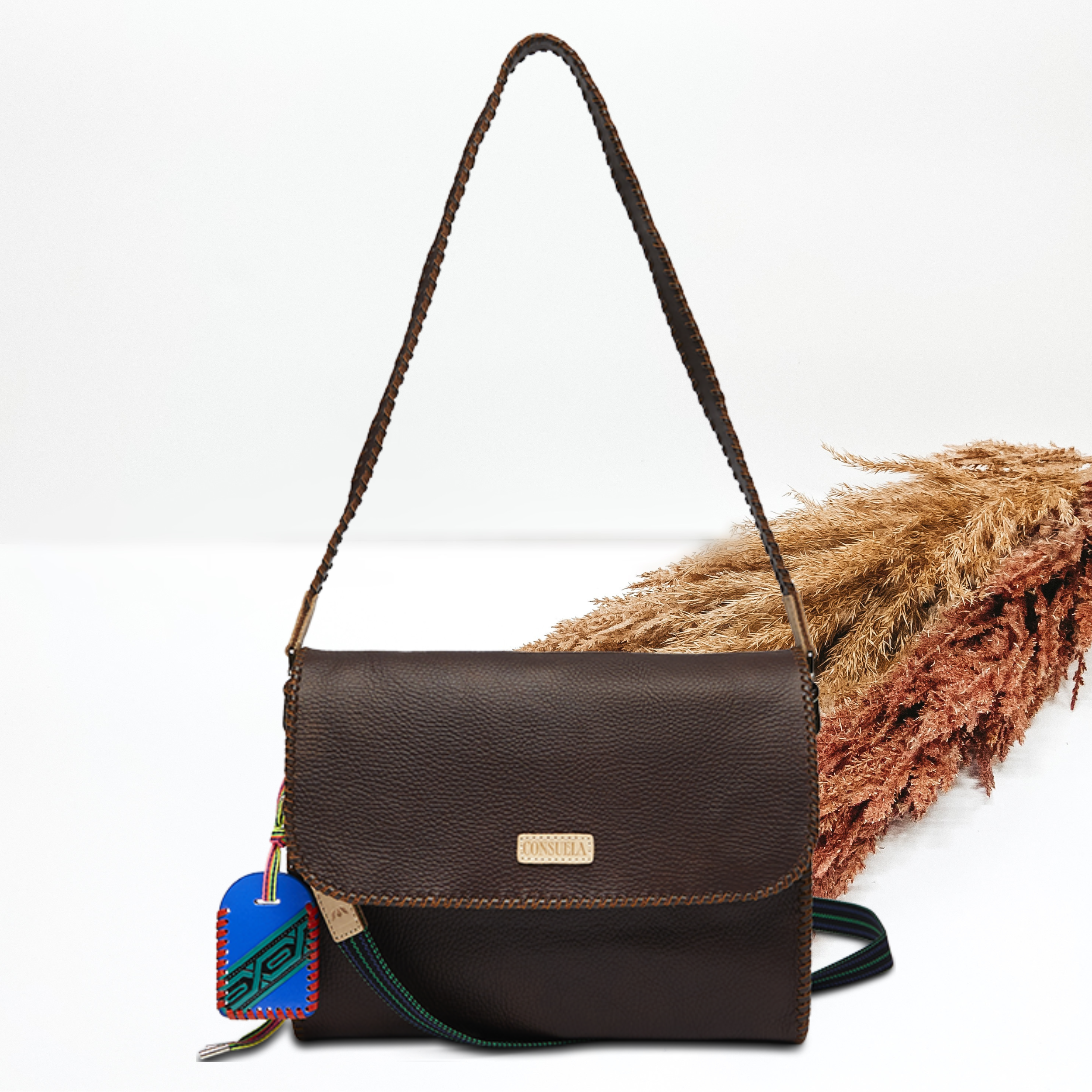 Brown, rectangle crossbody pictured on a white background. 