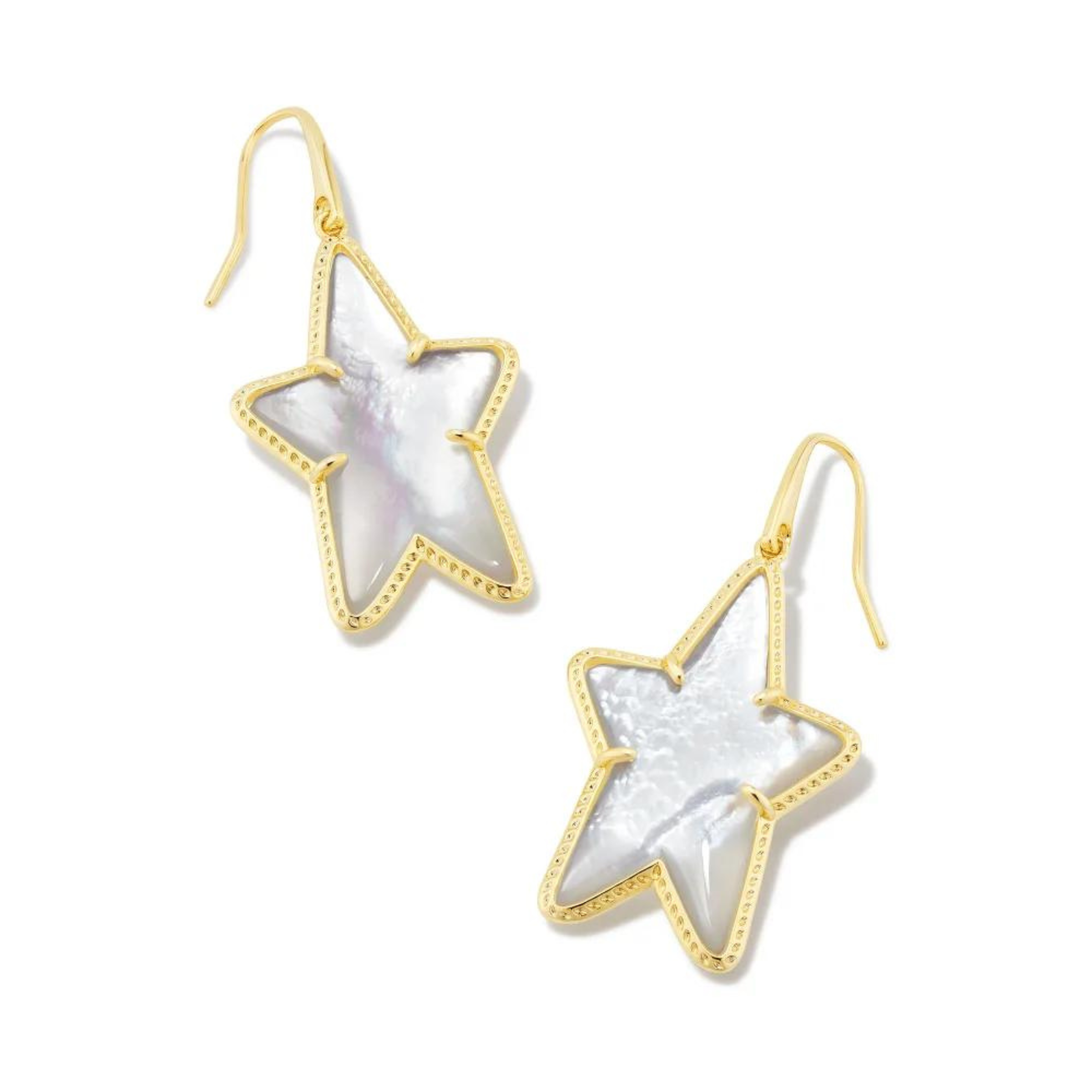 Pictured on a white background are gold fish hook earrings with a gold star dangle that includes an ivory colored star shaped stone. 