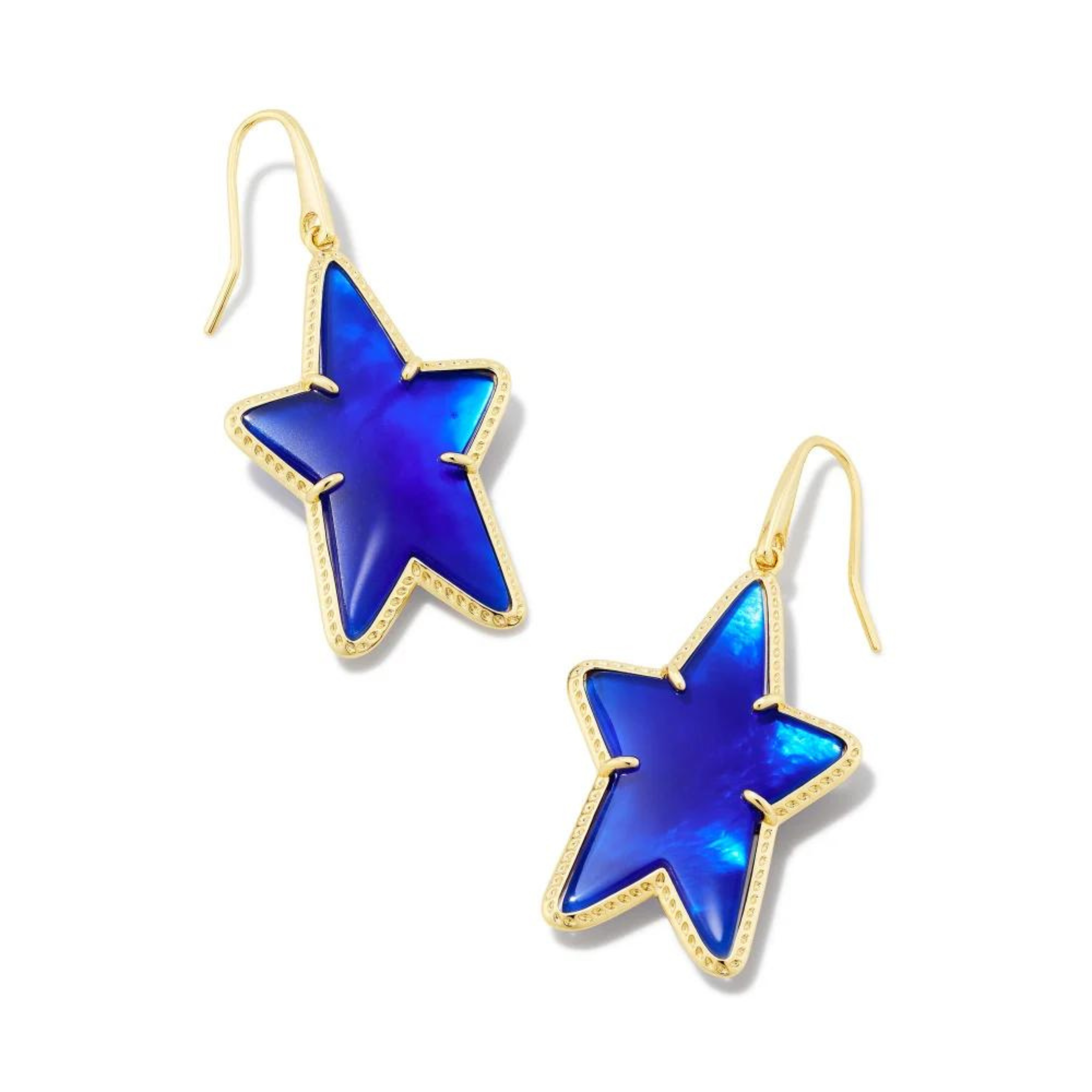 Pictured on a white background are gold fish hook earrings with a gold star dangle that includes a blue colored star shaped stone. 