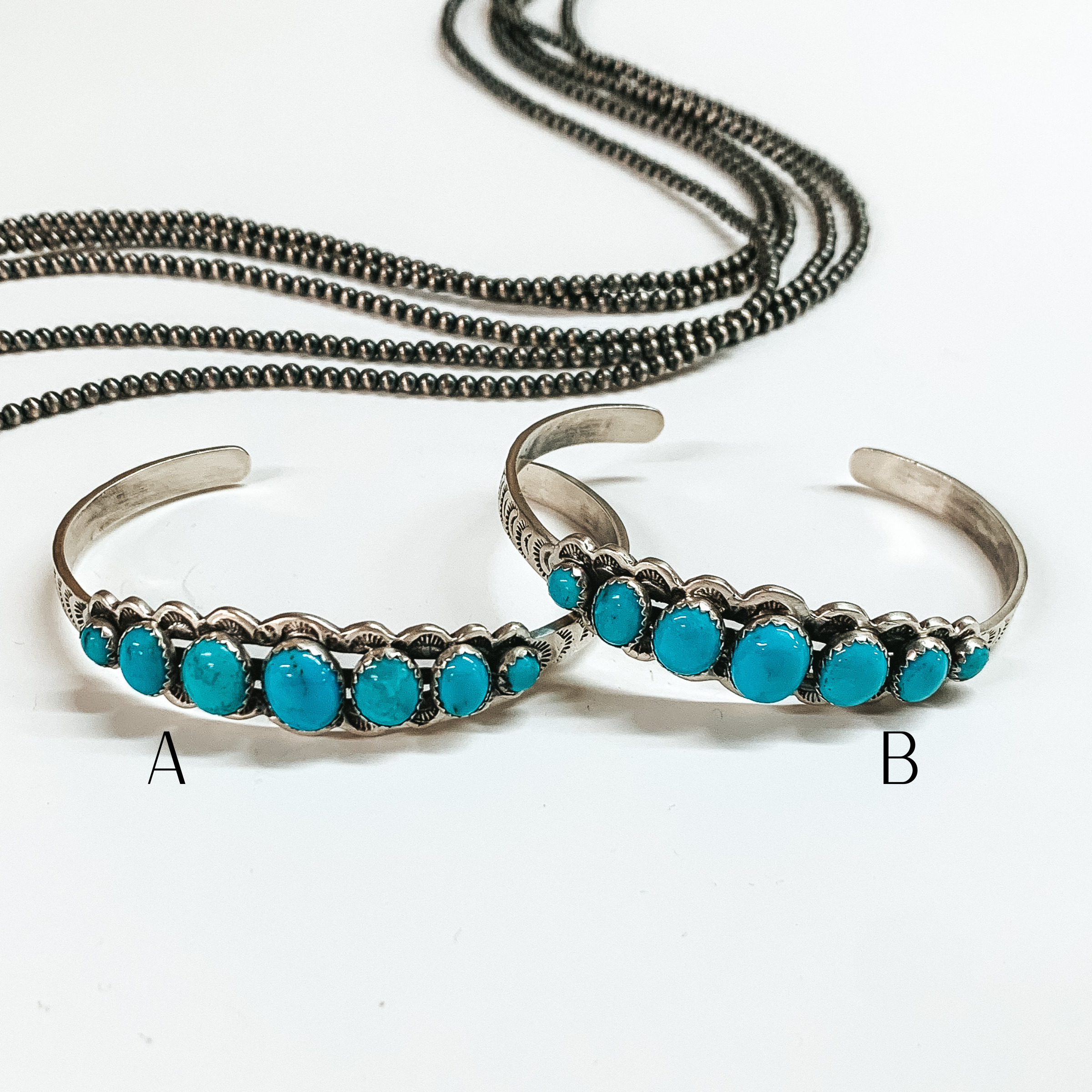 Russell Sam | Navajo Handmade Sterling Silver Cuff Bracelet with Seven Turquoise Stones - Giddy Up Glamour Boutique
