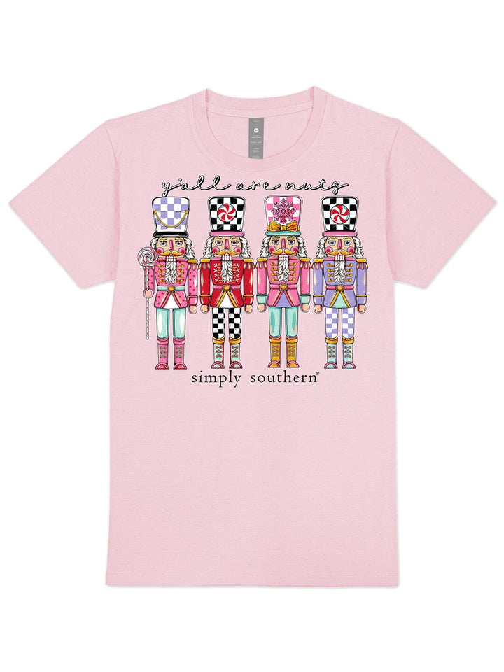 Sugar Plum Squad pink short sleeve graphic tee with four pastel nutcrackers and y&