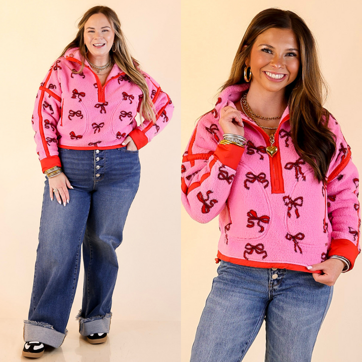 Two images of a woman wearing a pink fleece pullover half-zip with red bow pattern on a beige background.