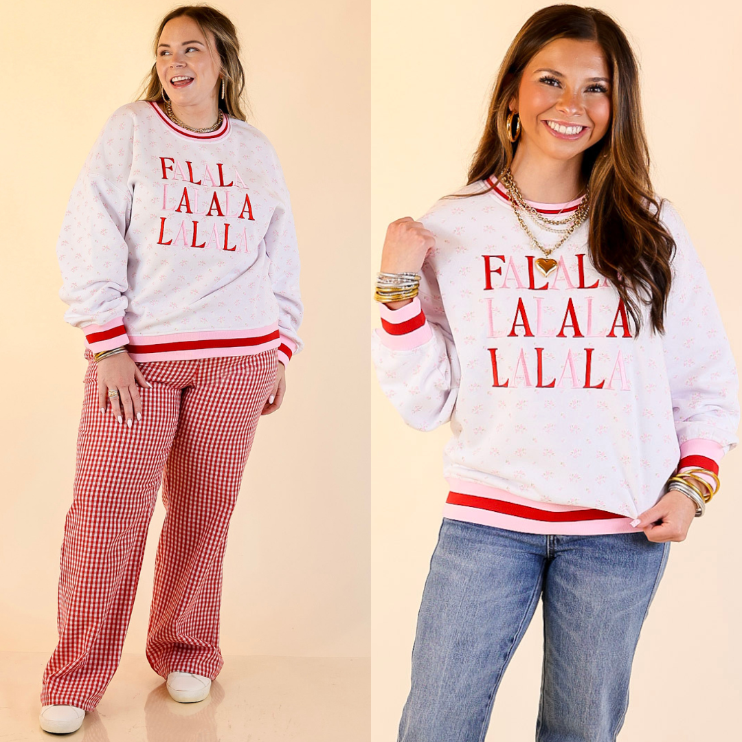 Models are wearing FALALA Floral Varsity sweatshirt. One in red checkered pants and the other in jeans.