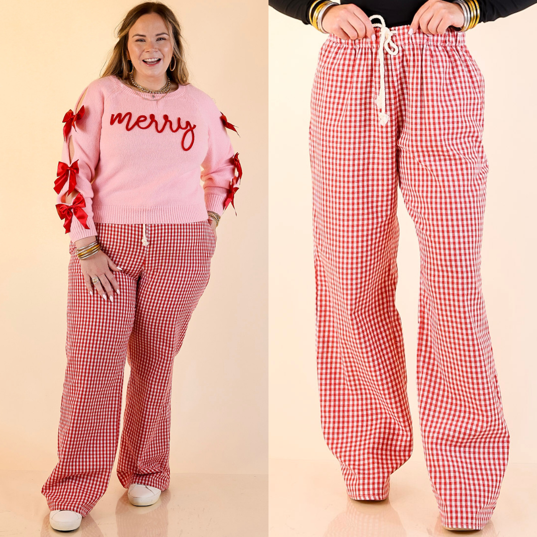 Models wearing red gingham checkered pants on a beige background