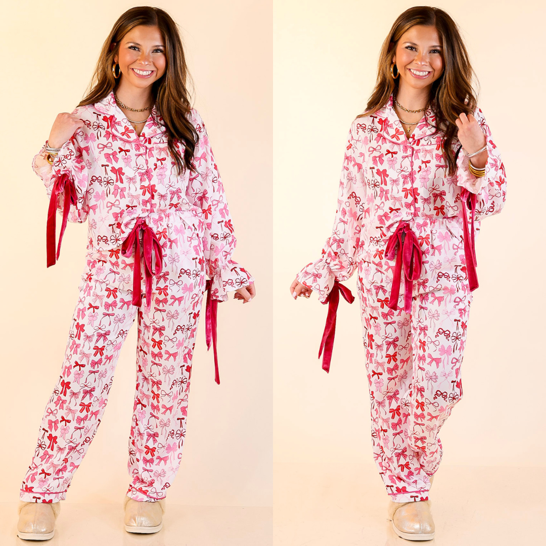 Woman wearing a pink bow pajama set with bow detailing on a beige background