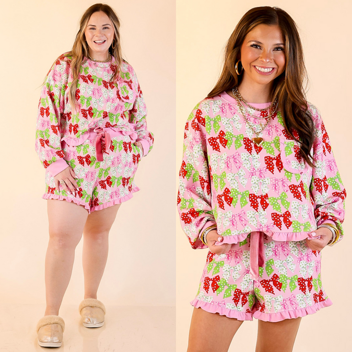 Women wearing matching pink polka dot bows with ruffle detailing pajama sets on a beige background.