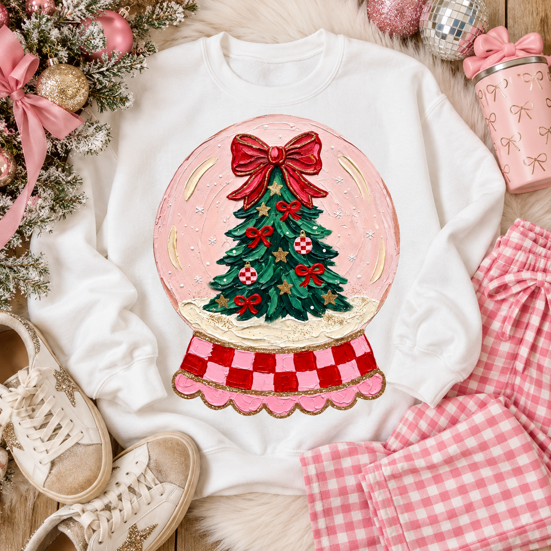 Snow Globe Tree Christmas graphic tee or sweatshirt on white with a pink snow globe with a Christmas tree, red bow and checkered base