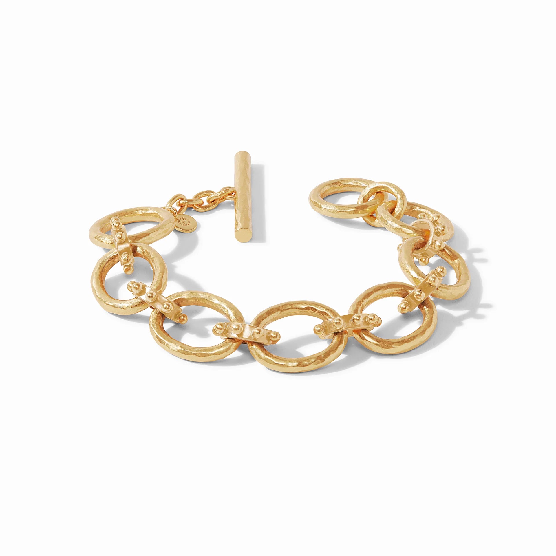 Gold chain link bracelet pictured on a white background. 
