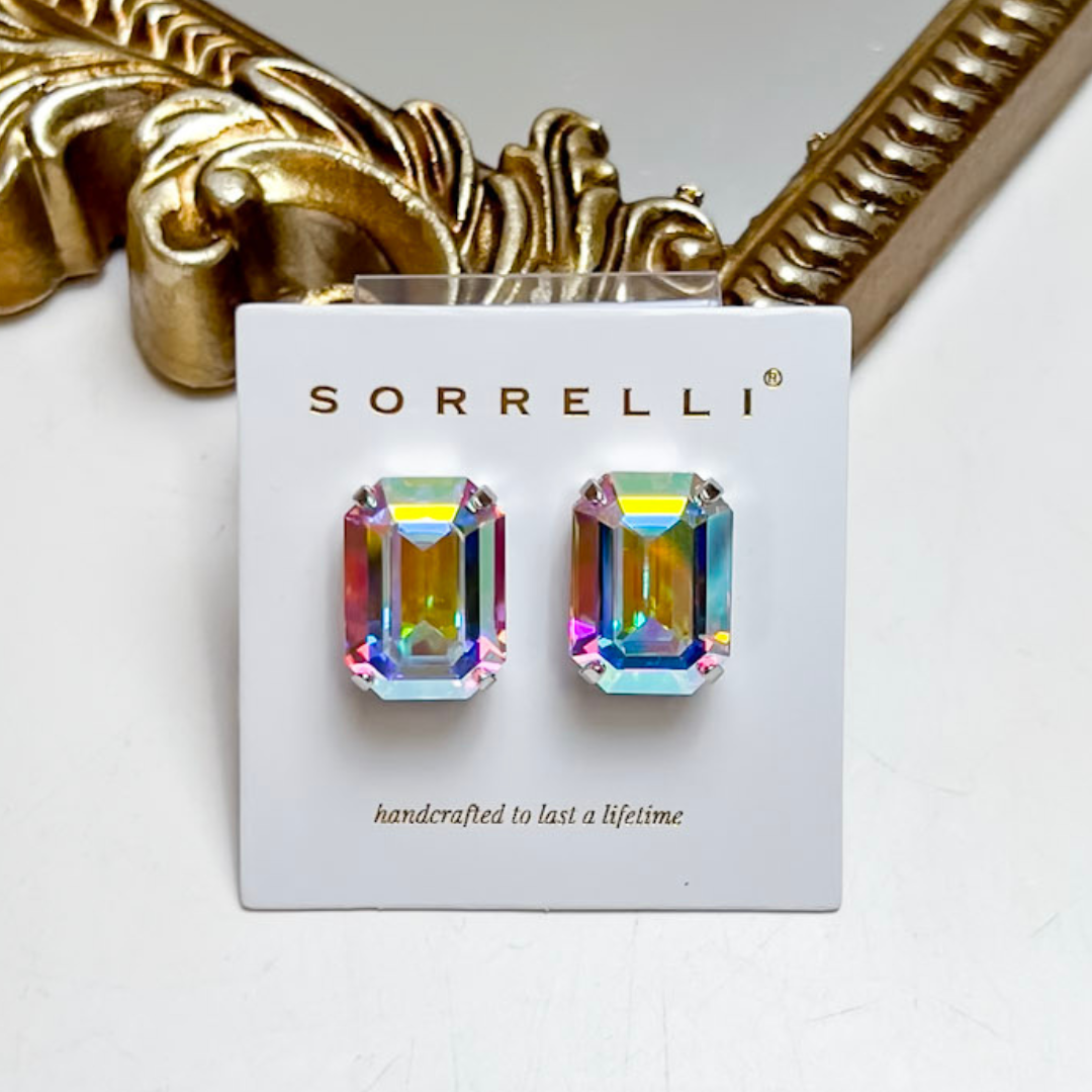 Sorrelli Brynn Stud Earrings in Palladium Silver featuring oversized emerald-cut Crystal Aurora Borealis stones with an iridescent rainbow finish.