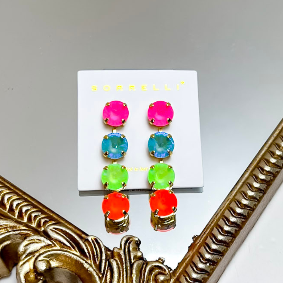Sorrelli Mara Statement Earrings in Bright Gold Tone and Candy Carnival featuring long drop designs with oversized hot pink, turquoise, lime green, and orange round crystals.