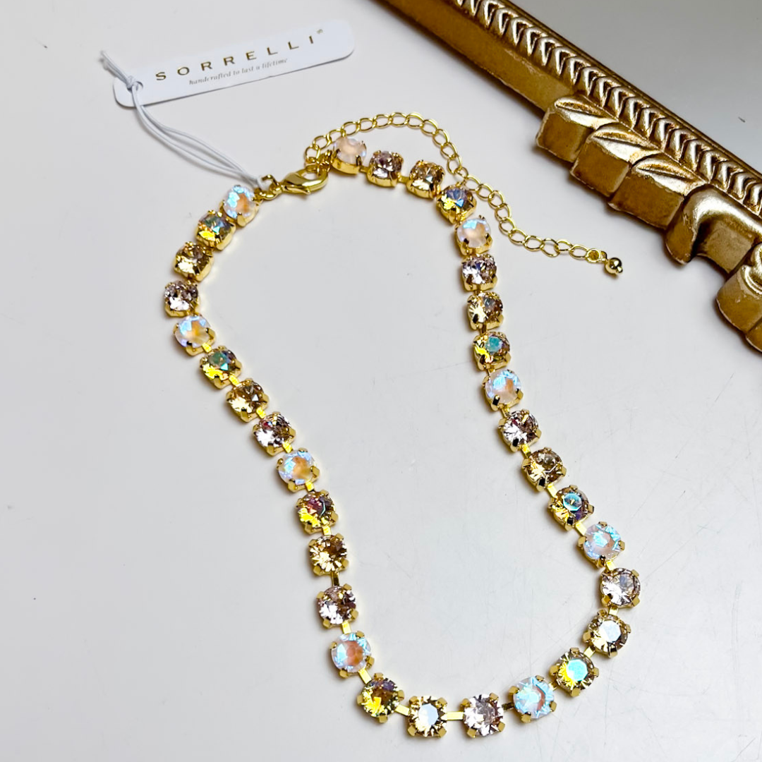 Sorrelli Matilda Choker Necklace in Bright Gold Tone and Golden Goddess featuring round faceted crystals in champagne, blush, neutral, and iridescent tones.