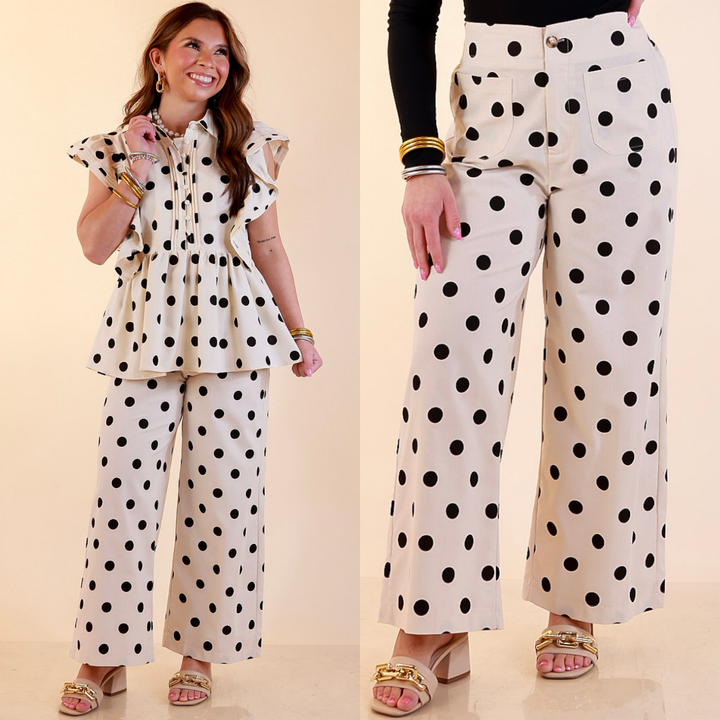 Model is wearing Wide Leg Black Polka Dot Print Pant with Front Patch Pocket in Cream against a beige backdrop. 