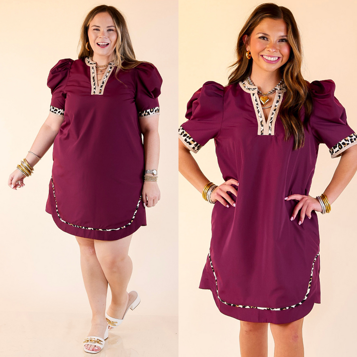 Women wearing maroon dress with balloon sleeves featuring a leopard print trim detail against a beige background. 
