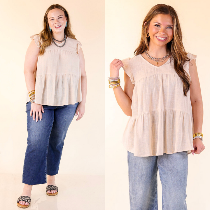 Stay wonderful in this adorable new top! It includes a v neckline, tiered body, and ruffle cap sleeves. Available in sizes small through plus size.