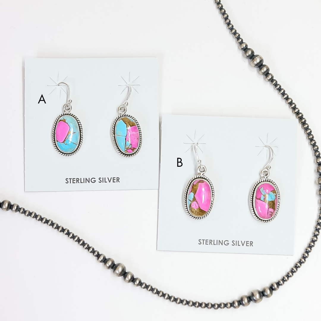 Pair of sterling silver earrings with colorful cotton candy stones on white cards, with a necklace in the foreground.
