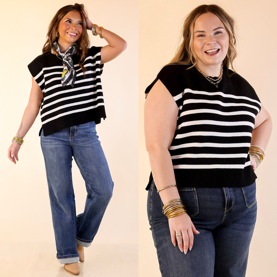 Models are wearing Drop Shoulder Knit Sweater in Black with Ivory Stripes and blue jeans on a beige background