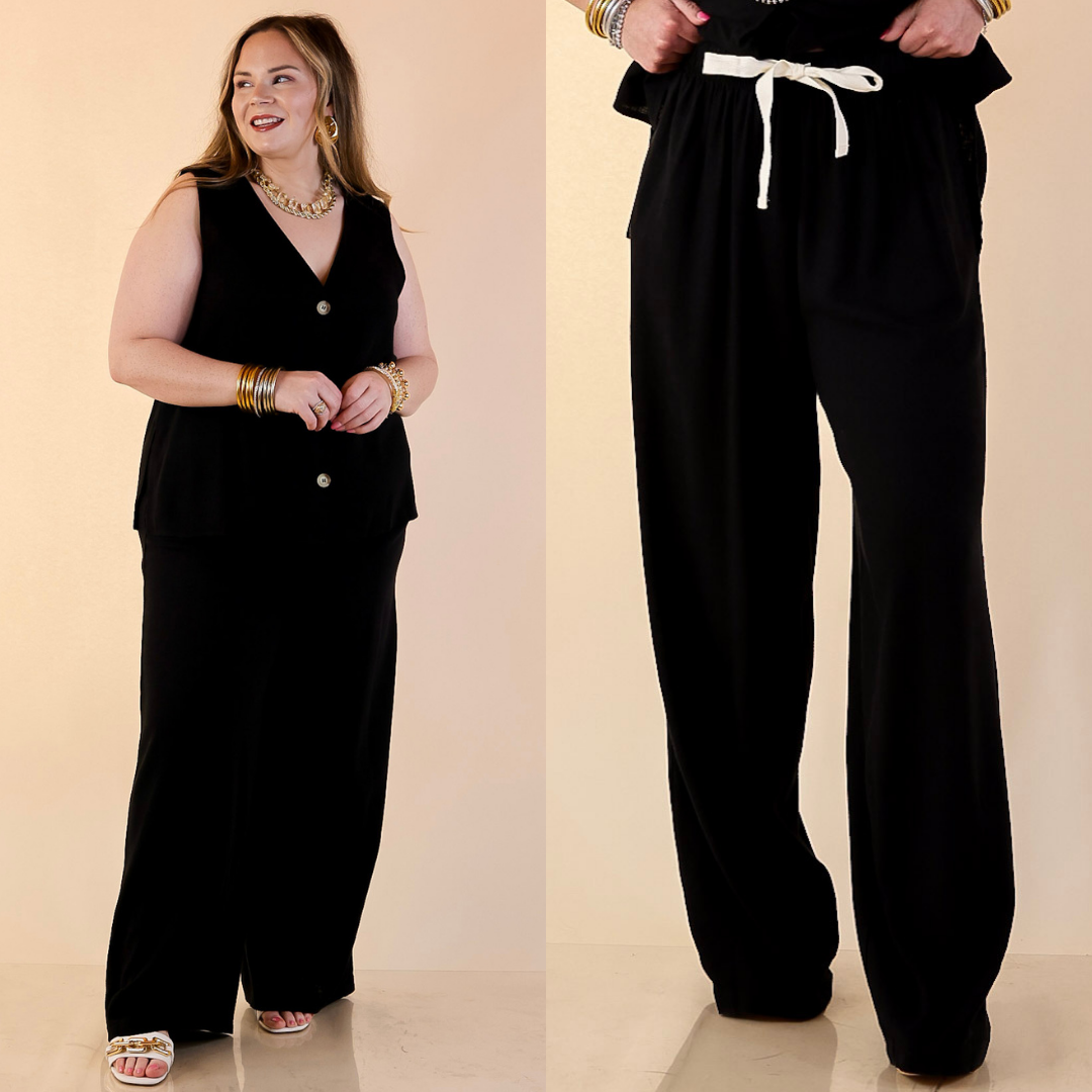 Models are wearing Drawstring Linen Pants in Black with Matching Vest against a beige backdrop. 