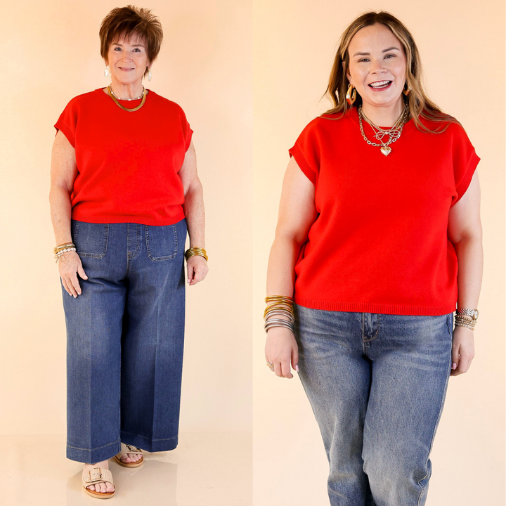 Featuring a red classic crew neck, this versatile piece is perfect for layering or wearing solo.  Sizes S/M through L/XL.