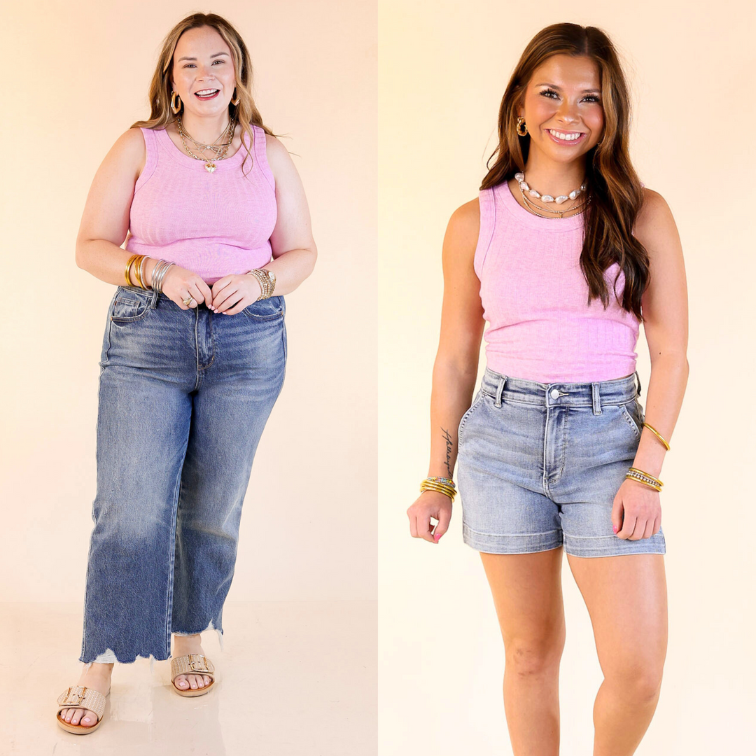 This top features a trendy ribbed texture, sleeveless design, and cropped length. Sizes small through large.