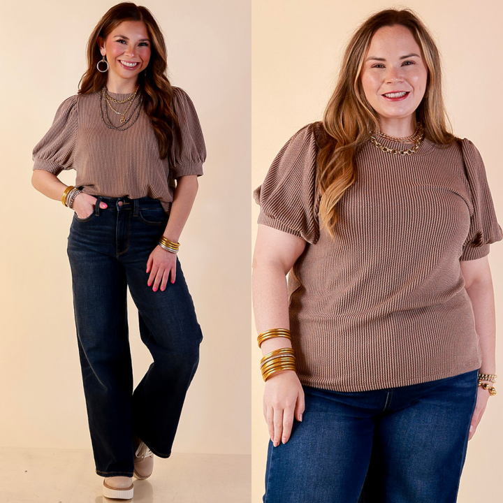 Models are wearing Puff Short Sleeve Ribbed Top with Scoop Neck in Brown with Jeans against a beige backdrop. 