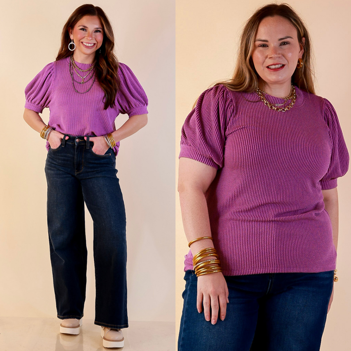 Models are wearing Puff Short Sleeve Ribbed Top with Scoop Neck in Purple with Jeans against a beige backdrop. 