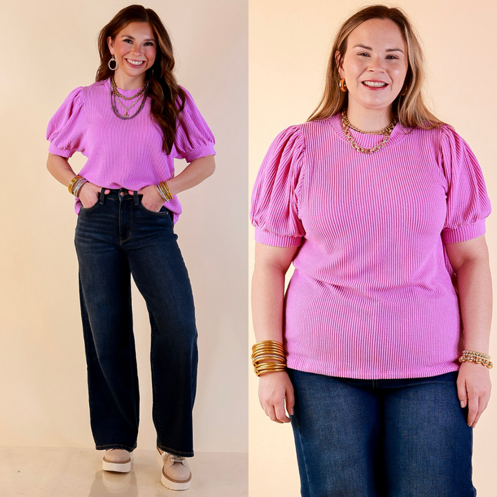 Models are wearing Puff Short Sleeve Ribbed Top with Scoop Neck in Violet Purple with Jeans against a beige backdrop. 