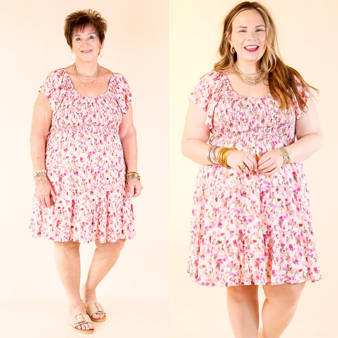 This adorable dress includes short sleeves with ruffle detailing, a ruffle tiered body, and v neckline. Available in plus sizes only.