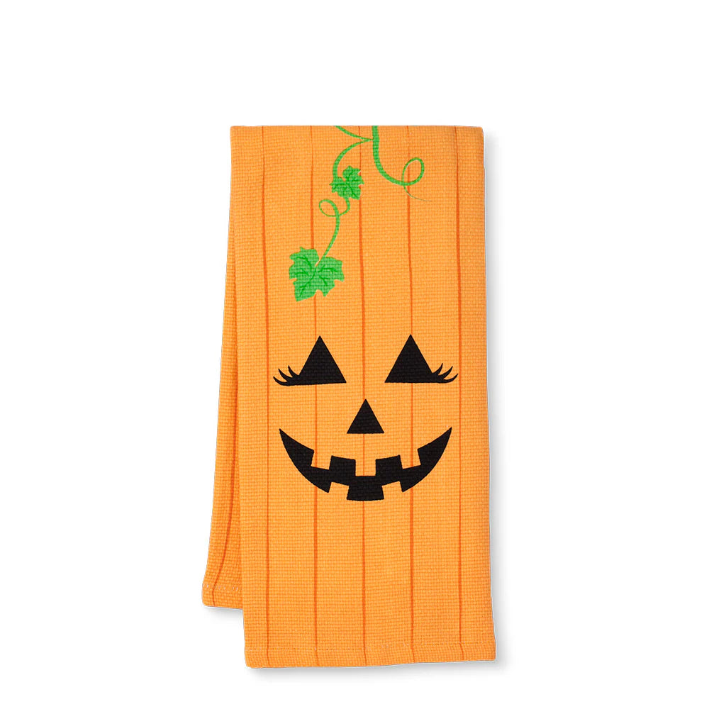 Orange towel with a jack-o'-lantern face design on a white background