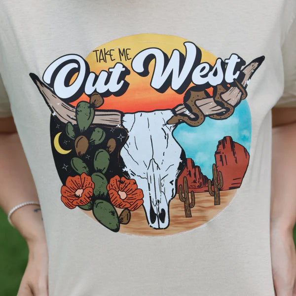 T-shirt with a graphic design featuring a cow skull, cacti, and desert landscape with 'Take Me Out West' text.