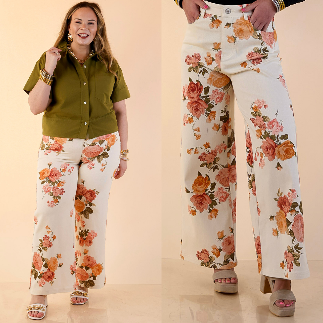 Models are wearing Cropped Wide Leg Vintage Rose Floral Print Jeans in Ivory against a beige backdrop. 