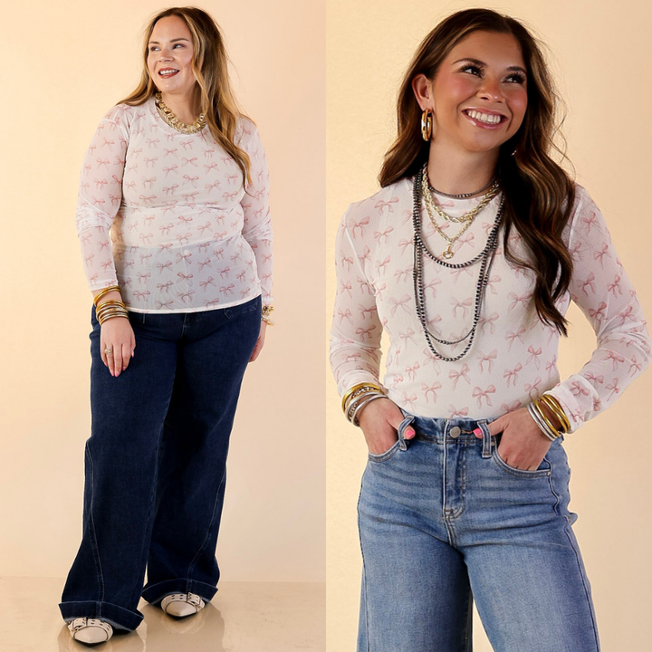 Models are wearing the Perfect Layer Mesh Long Sleeve Top in Coquette Pink Bow Print in Ivory with Jeans against a beige backdrop.