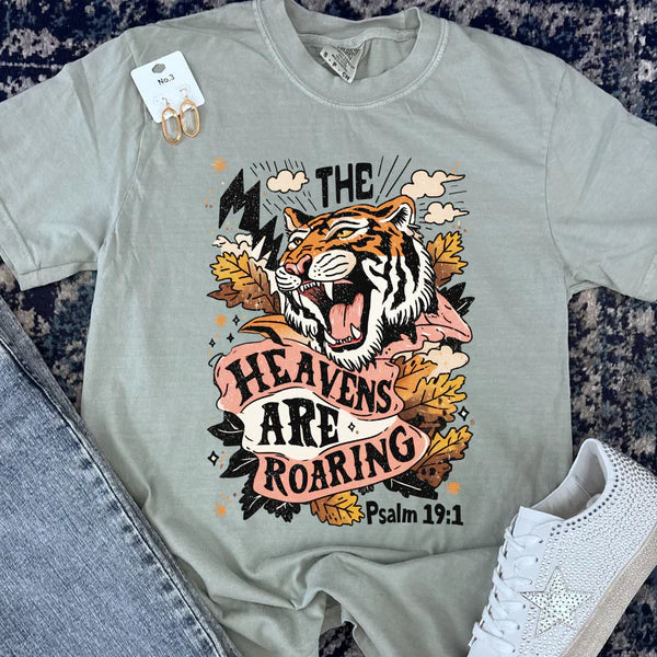 Gray t-shirt with a tiger graphic and text on a textured surface