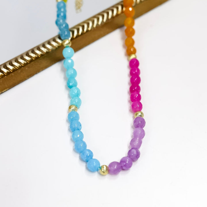 Colorful beaded necklace on a white background