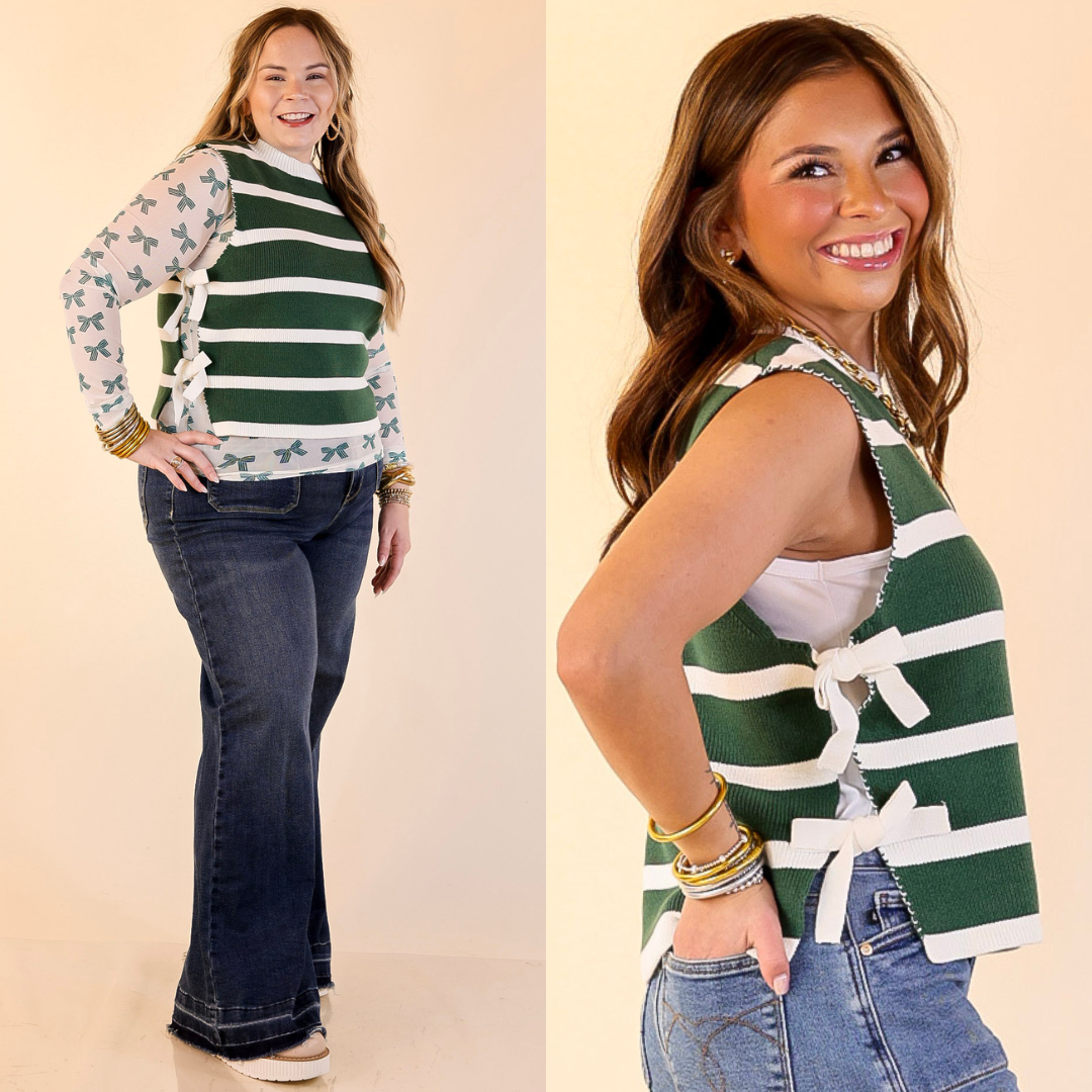 Women wearing a forest green and white striped top with a bow detail, standing against a plain background.