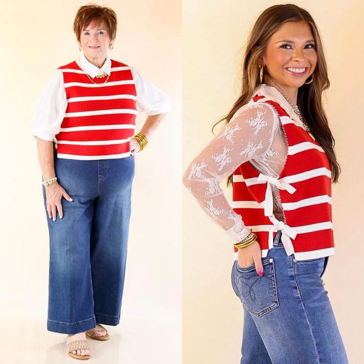 Two women wearing red and white striped tops and blue jeans on a beige background