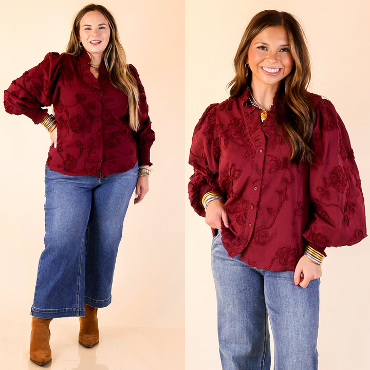 Two images of a woman wearing a maroon embroidered floral blouse and blue jeans on a beige background.