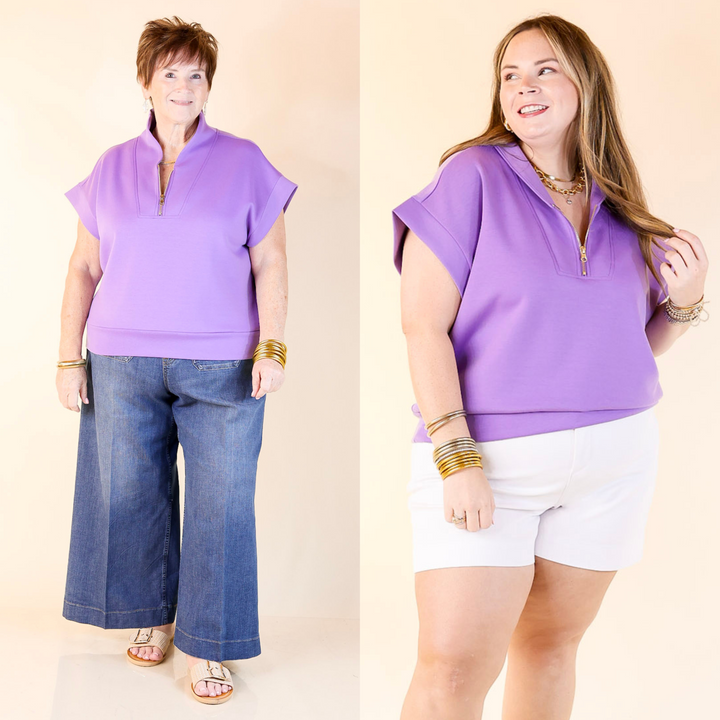 Polished meets practical—this black half zip shirt features a gold zipper, classic collar, and easy, elevated style. Sizes in S/M and L/XL.