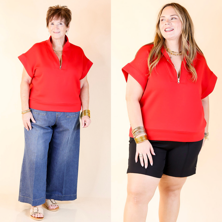 Polished meets practical—this black half zip shirt features a gold zipper, classic collar, and easy, elevated style. Sizes in S/M and L/XL.