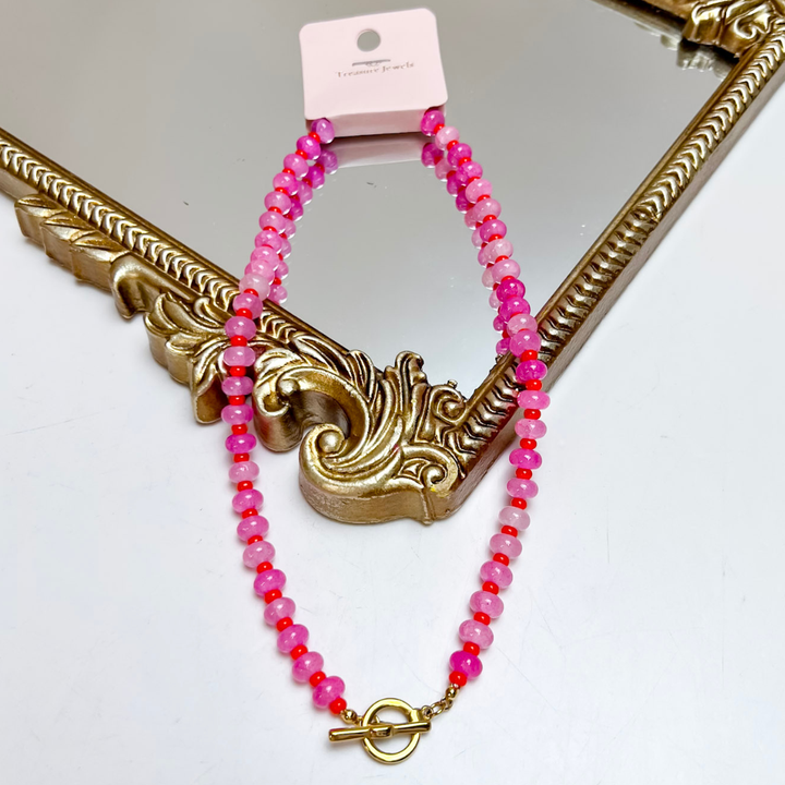 Treasure Jewels pink faceted beaded necklace featuring shades of blush and hot pink with a polished gold front toggle clasp.