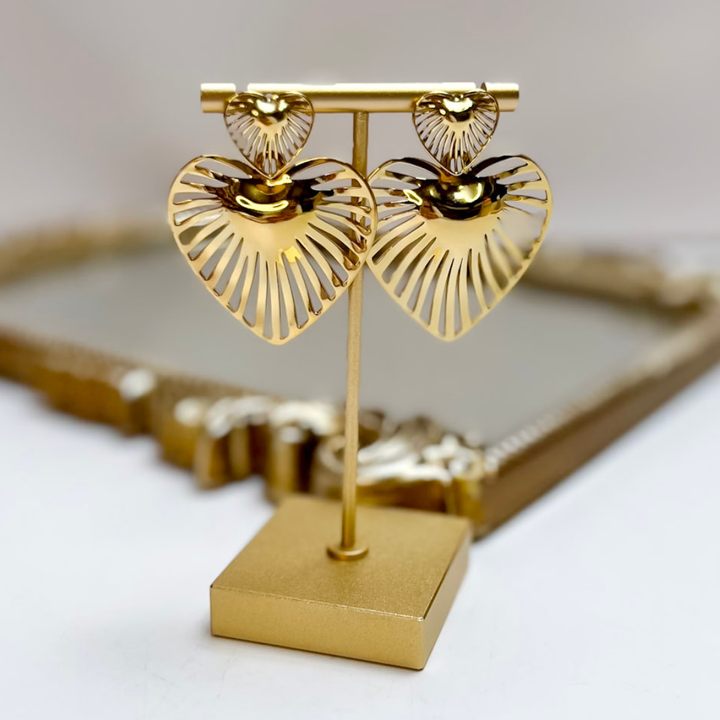 Treasure Jewels gold double heart statement earrings featuring a textured heart stud and a large openwork heart drop.
