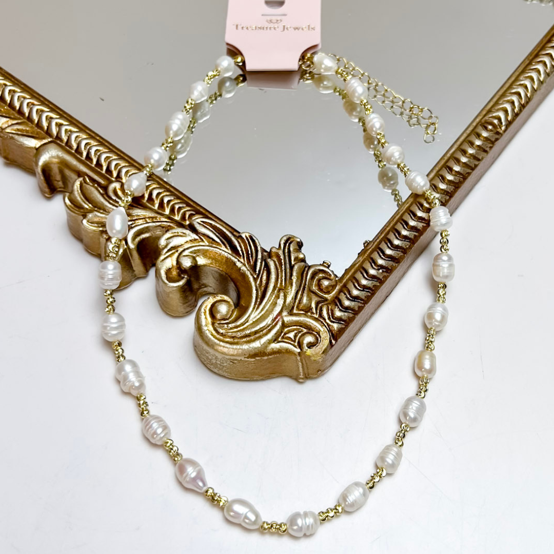 Treasure Jewels gold chain necklace featuring genuine freshwater pearls spaced along a delicate chain with an adjustable extender.
