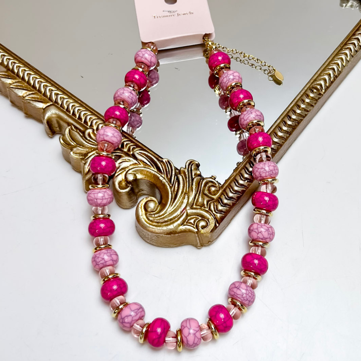 Treasure Jewels pink beaded necklace featuring hot pink marbled beads, blush stone-inspired beads, translucent glass accents, and gold spacers.