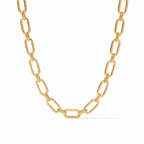 Pictured is a gold, hammered chain link necklace pictured on a white background. 