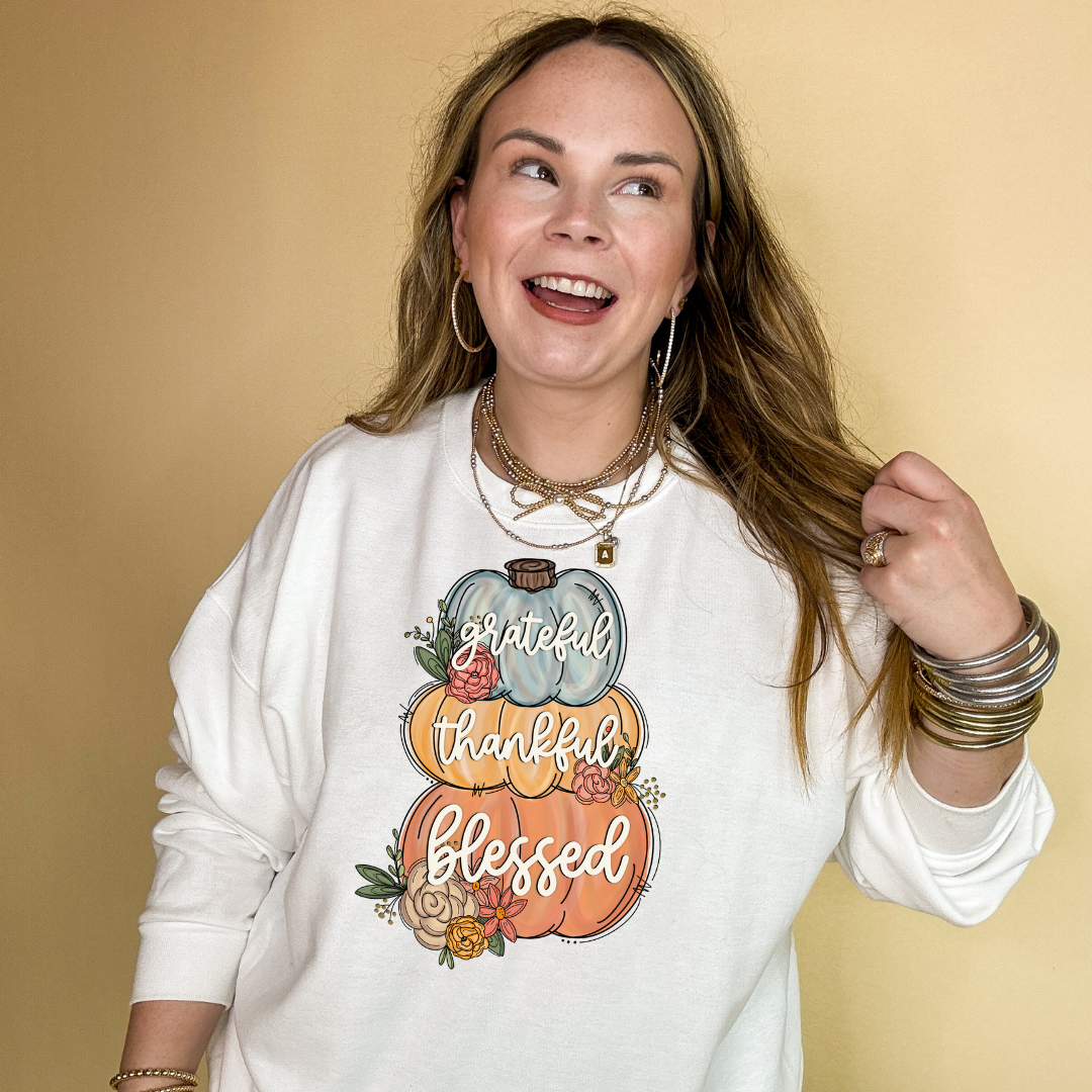 Online Exclusive | Grateful, Thankful, Blessed Stacked Pumpkins and Floral Arrangement Graphic Sweatshirt in Multiple Color Options