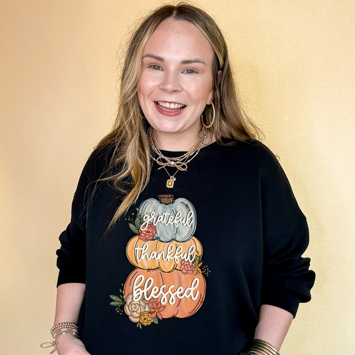 Online Exclusive | Grateful, Thankful, Blessed Stacked Pumpkins and Floral Arrangement Graphic Sweatshirt in Multiple Color Options