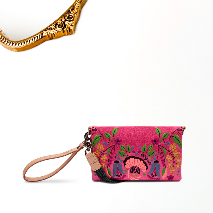 Pink embroidered clutch with floral design on a white background